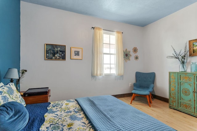 130 Holbox Dr, Del Valle, TX 78617 - bedroom featuring wood finished floors and baseboards