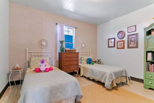 130 Holbox Dr, Del Valle, TX 78617 - bedroom featuring wood finished floors and baseboards