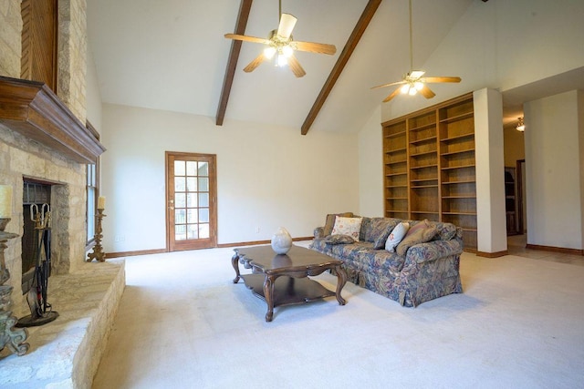22207 Moulin Dr, Spicewood, TX 78669 - carpeted living area with ceiling fan, a fireplace, high vaulted ceiling, baseboards, and beamed ceiling