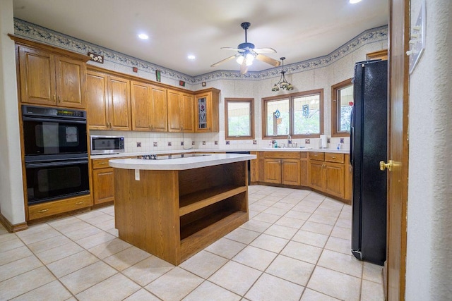 22207 Moulin Dr, Spicewood, TX 78669 - kitchen featuring brown cabinetry, open shelves, ceiling fan, light countertops, and black appliances