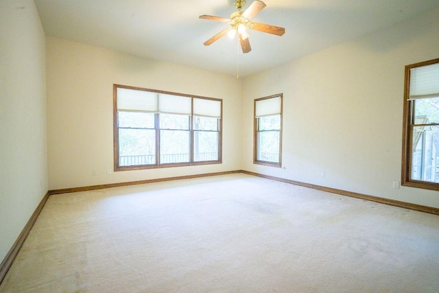 22207 Moulin Dr, Spicewood, TX 78669 - unfurnished room featuring baseboards, light colored carpet, and ceiling fan