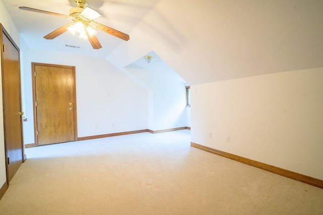 22207 Moulin Dr, Spicewood, TX 78669 - additional living space with ceiling fan, visible vents, light colored carpet, baseboards, and lofted ceiling