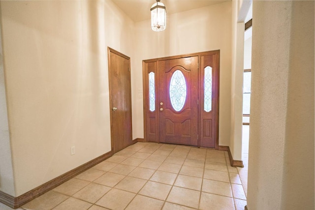 22207 Moulin Dr, Spicewood, TX 78669 - entryway with light tile patterned flooring and baseboards