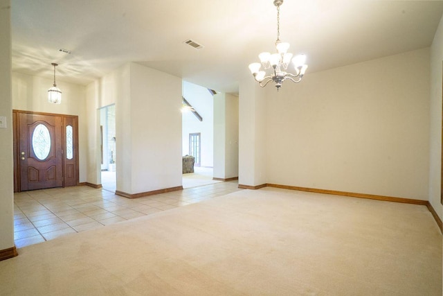 22207 Moulin Dr, Spicewood, TX 78669 - carpeted entryway with tile patterned floors, baseboards, a notable chandelier, and visible vents