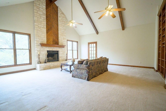 22207 Moulin Dr, Spicewood, TX 78669 - living room featuring ceiling fan, beam ceiling, carpet floors, high vaulted ceiling, and a stone fireplace