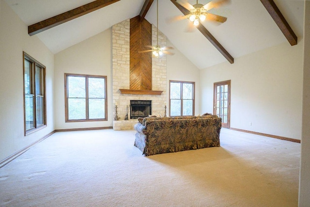 22207 Moulin Dr, Spicewood, TX 78669 - living room with a ceiling fan, a fireplace, beamed ceiling, high vaulted ceiling, and carpet flooring