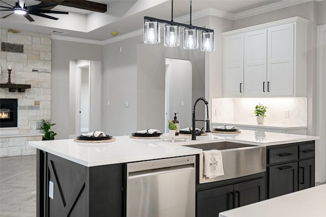 122 Liberty Bell Ln, Fischer, TX 78623 - kitchen with dishwasher, white cabinetry, a sink, a ceiling fan, and light countertops