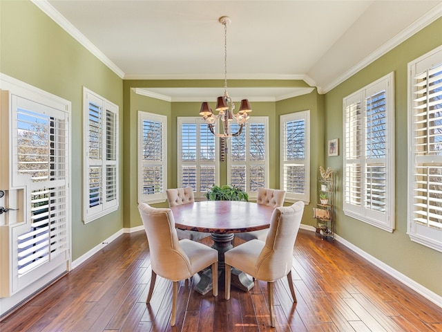 217 Piedmont Hills Pass, Austin, TX 78732 - dining room featuring a chandelier, dark wood finished floors, plenty of natural light, ornamental molding, and baseboards