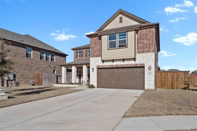 traditional home with an attached garage, concrete driveway, and fence