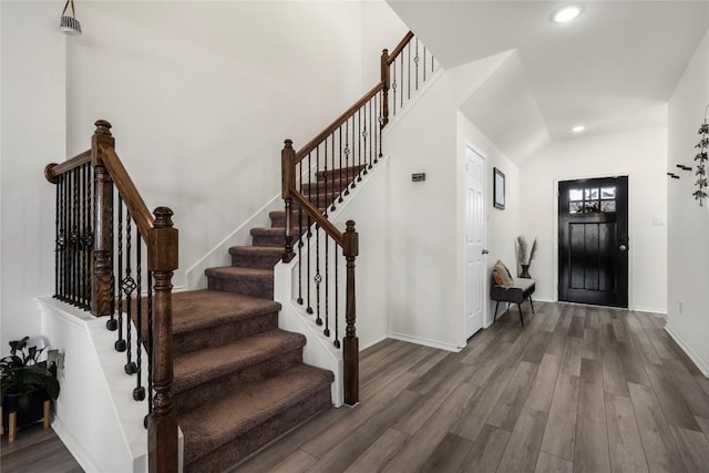 entrance foyer with recessed lighting, baseboards, wood finished floors, and stairs
