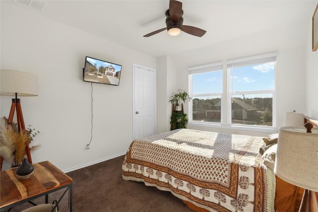bedroom with visible vents, baseboards, a ceiling fan, and carpet flooring