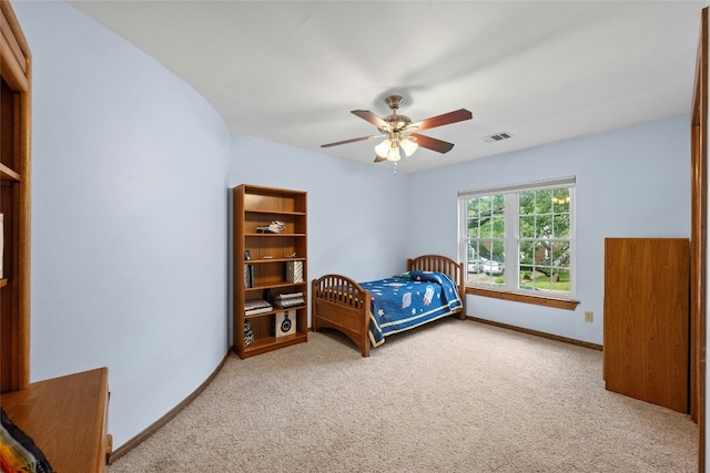 bedroom featuring visible vents, baseboards, carpet flooring, and ceiling fan