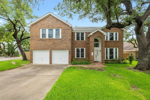 view of front of home with brick siding, a front lawn, an attached garage, and concrete driveway