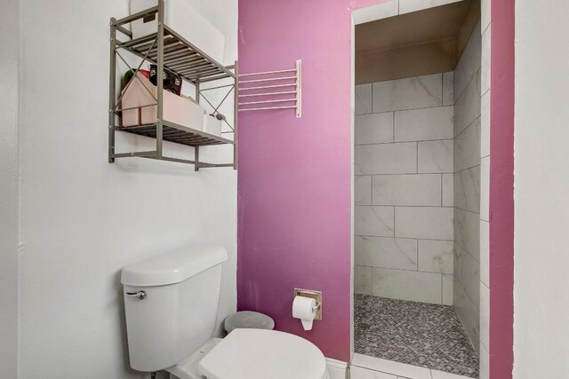 12333 Blue Water Dr, Austin, TX 78758 - full bathroom with toilet and tiled shower