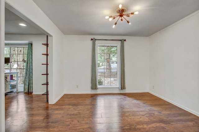 12333 Blue Water Dr, Austin, TX 78758 - empty room featuring a chandelier, hardwood / wood-style floors, baseboards, and recessed lighting