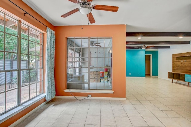 12333 Blue Water Dr, Austin, TX 78758 - tiled empty room with a ceiling fan, healthy amount of natural light, baseboards, and beam ceiling