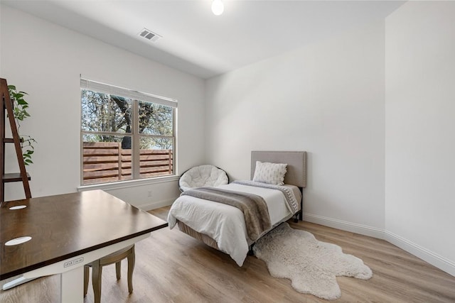 1017 S Quinlan Park Rd, Austin, TX 78732 - bedroom featuring wood finished floors and baseboards