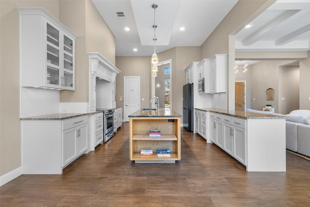 1017 S Quinlan Park Rd, Austin, TX 78732 - kitchen with appliances with stainless steel finishes, stone counters, white cabinetry, and recessed lighting