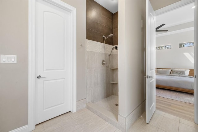 1017 S Quinlan Park Rd, Austin, TX 78732 - ensuite bathroom with tile patterned floors, tiled shower, and a ceiling fan