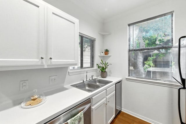 611 E 45th St Unit 15, Austin, TX 78751 - kitchen featuring white cabinets, crown molding, light countertops, wood finished floors, and open shelves