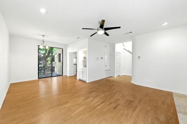 611 E 45th St Unit 15, Austin, TX 78751 - unfurnished living room featuring a chandelier, light wood-style flooring, ceiling fan, and recessed lighting