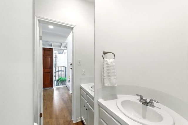 611 E 45th St Unit 15, Austin, TX 78751 - bathroom with vanity and wood finished floors