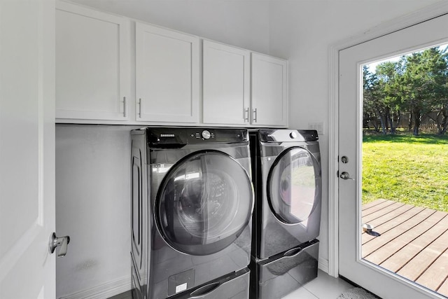 22113 Shotts Dr, Spicewood, TX 78669 - laundry room with washing machine and clothes dryer, cabinet space, and light tile patterned floors