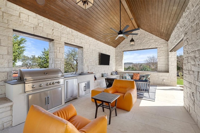 599 Vendemmia Bnd, Austin, TX 78738 - view of patio / terrace with exterior kitchen, a ceiling fan, and outdoor lounge area