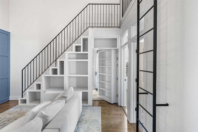 599 Vendemmia Bnd, Austin, TX 78738 - stairs featuring a high ceiling and wood finished floors