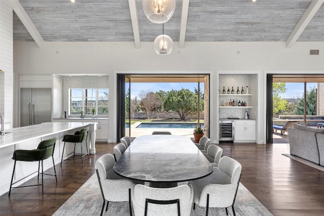 599 Vendemmia Bnd, Austin, TX 78738 - dining area featuring beverage cooler, plenty of natural light, a dry bar, dark wood-style floors, and wood ceiling