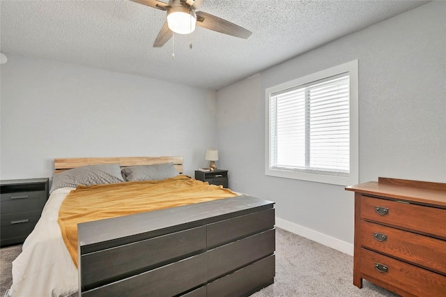 2001 Iroquois Ln, Austin, TX 78741 - bedroom with light colored carpet, a textured ceiling, and ceiling fan
