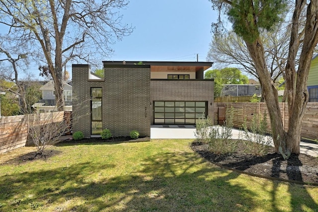 2109 Glendale Pl, Austin, TX 78704 - contemporary home featuring brick siding and a garage