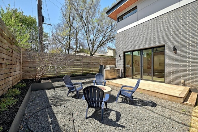2109 Glendale Pl, Austin, TX 78704 - fenced backyard featuring a fire pit and a deck