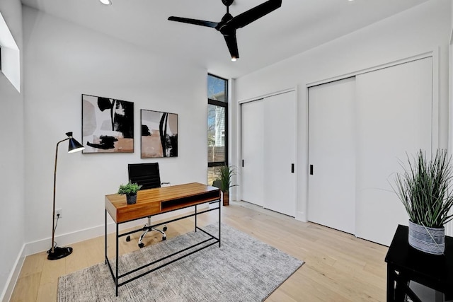 2109 Glendale Pl, Austin, TX 78704 - office area featuring light wood-style flooring, a ceiling fan, expansive windows, recessed lighting, and baseboards