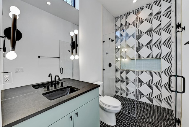 2109 Glendale Pl, Austin, TX 78704 - full bathroom featuring vanity, a shower stall, toilet, tile patterned floors, and recessed lighting