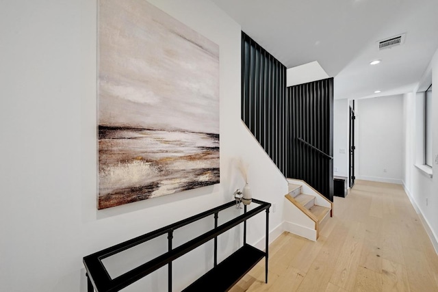 2109 Glendale Pl, Austin, TX 78704 - hallway with wood finished floors, recessed lighting, baseboards, and stairs