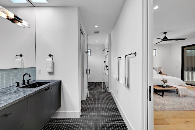 2109 Glendale Pl, Austin, TX 78704 - full bath with vanity, ensuite bathroom, a stall shower, recessed lighting, and baseboards