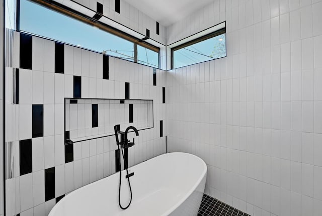 2109 Glendale Pl, Austin, TX 78704 - full bathroom featuring tile walls and a soaking tub