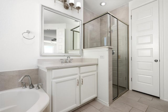 19604 Summit Glory Trl, Spicewood, TX 78669 - full bath featuring a garden tub, a shower stall, vanity, and tile patterned flooring