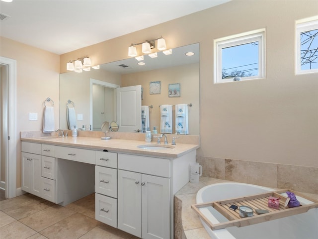 300 E Heron Dr, Marble Falls, TX 78654 - full bathroom with double vanity, a relaxing tiled tub, and tile patterned floors