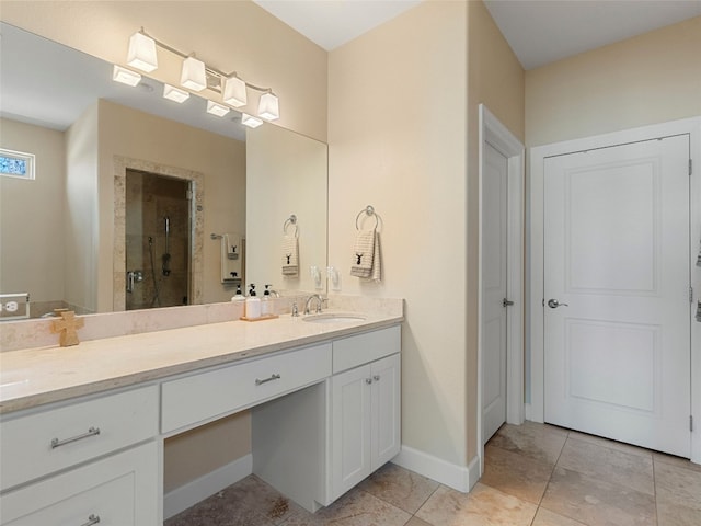 300 E Heron Dr, Marble Falls, TX 78654 - bathroom featuring vanity, a shower stall, tile patterned flooring, and baseboards