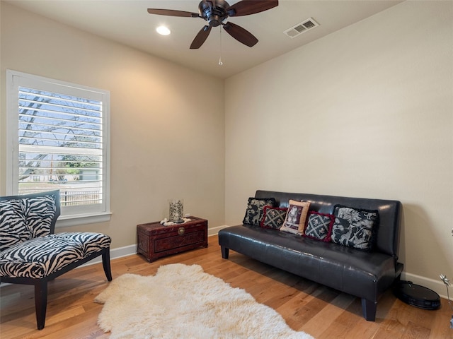 300 E Heron Dr, Marble Falls, TX 78654 - living area featuring wood finished floors, a ceiling fan, and baseboards