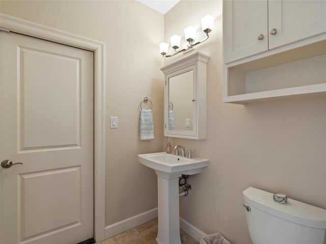 300 E Heron Dr, Marble Falls, TX 78654 - half bath with baseboards and toilet