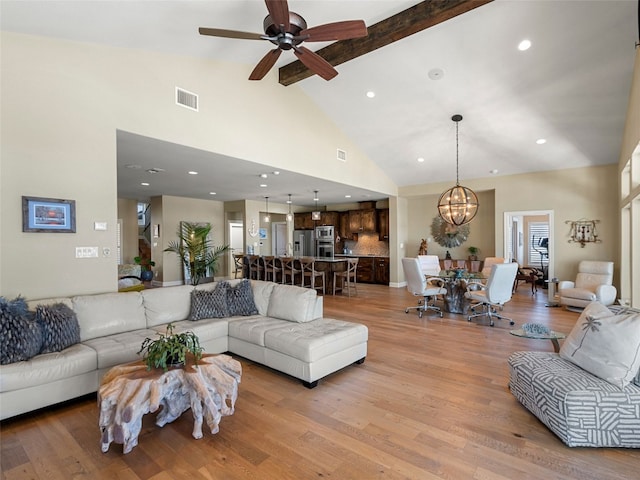 300 E Heron Dr, Marble Falls, TX 78654 - living area with beam ceiling, a chandelier, high vaulted ceiling, ceiling fan, and light wood-style flooring