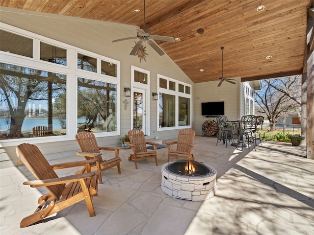 300 E Heron Dr, Marble Falls, TX 78654 - view of patio with a fire pit, a ceiling fan, a water view, and outdoor dining space