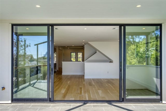 entryway featuring recessed lighting, baseboards, and wood finished floors