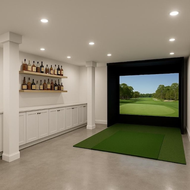717 Meriden Ln, Austin, TX 78703 - rec room with golf simulator, concrete floors, recessed lighting, and baseboards