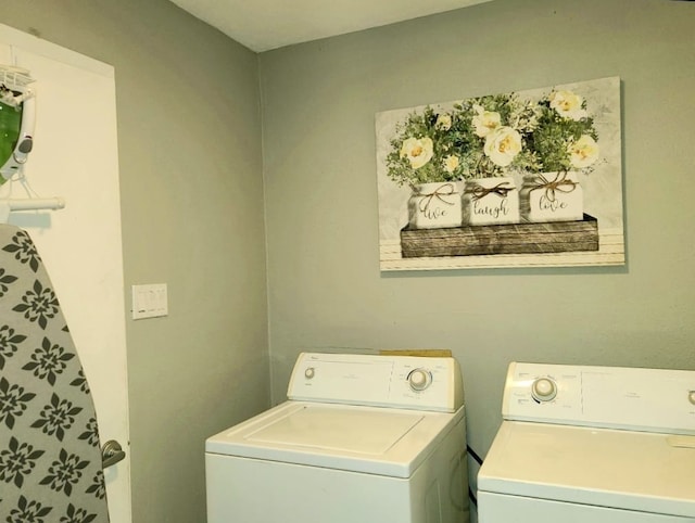 laundry area featuring washer and dryer and laundry area