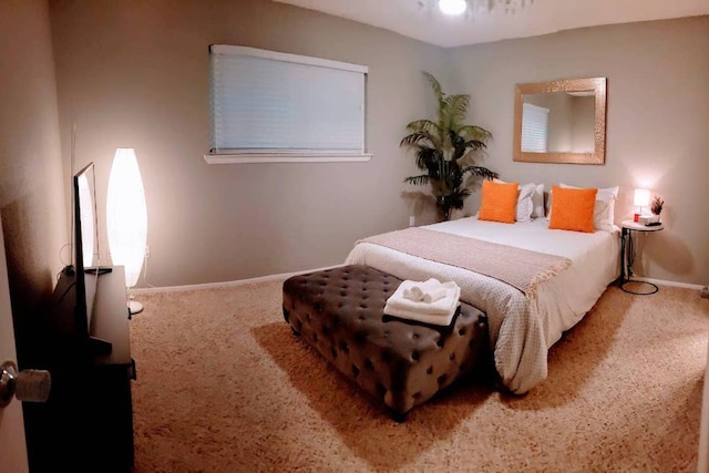 bedroom featuring baseboards and carpet floors