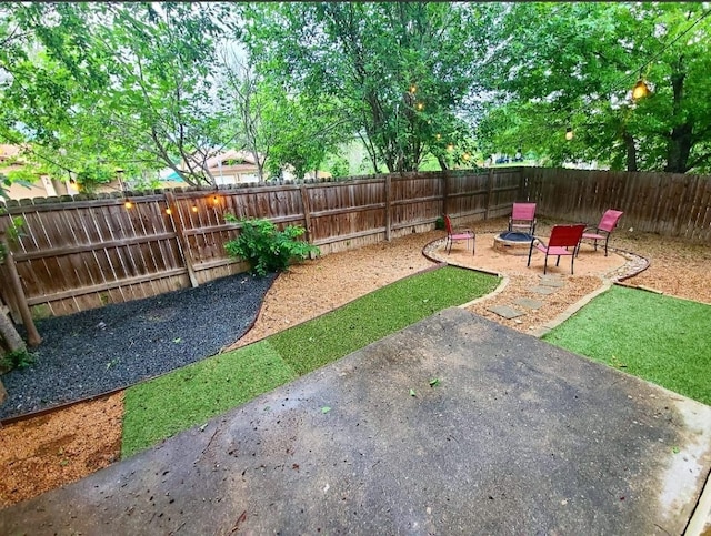 view of yard with a patio and a fenced backyard